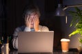 Tired and frustration elderly woman working and using laptop at late night Royalty Free Stock Photo
