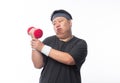 Tired funny fat asian man in sport outfits exercising with dumbbell and looking to camera isolated on white background.