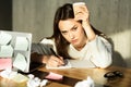 Tired girl has no ideas and holds coffee Royalty Free Stock Photo