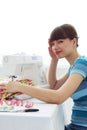 Tired Girl seamstress and sewing machine Royalty Free Stock Photo