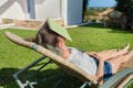 Tired teen girl sleeping with book on her face Royalty Free Stock Photo