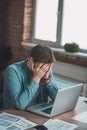 Handsome young man covering his face with hands Royalty Free Stock Photo