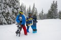 Tired but happy snowboarders relaxes