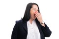 Tired hardworking businesswoman covering mouth yawning