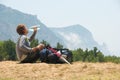 Tired hiker drinks water