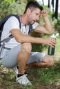 tired hiker drinks water from bottle Royalty Free Stock Photo