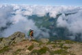 Tired hiker goes to the top