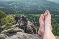 Tired hikers legs without shoes. Naked legs on peak Royalty Free Stock Photo