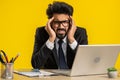 Tired indian business man suffering from headache problem tension, migraine, stress at home office Royalty Free Stock Photo