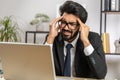 Tired indian business man suffering from headache problem tension, migraine, stress at home office Royalty Free Stock Photo