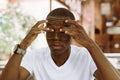 tired interracial dark skin man in eyeglasses touching and rubbing his eyes, feeling pain. Vision problem Royalty Free Stock Photo