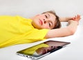 Tired Kid and Tablet Computer Royalty Free Stock Photo