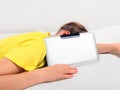 Tired Kid with Tablet Computer Royalty Free Stock Photo