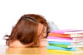 Tired lazy Asian woman sleeping near stack of books Royalty Free Stock Photo