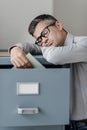 Tired office worker sleeping in the office Royalty Free Stock Photo