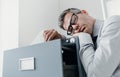 Tired office worker sleeping in the office Royalty Free Stock Photo