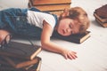 Tired little girl fell asleep for books Royalty Free Stock Photo