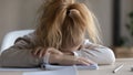 Exhausted little schoolgirl fall asleep studying at home Royalty Free Stock Photo