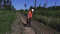 Tired loggers walking on forest road