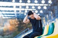 Tired male athlete resting, Asian holding his head, has a severe headache after running Royalty Free Stock Photo