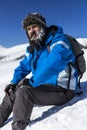 Tired man with beard resting during the climbing Royalty Free Stock Photo