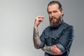 Tired man with beard and tattooes Royalty Free Stock Photo