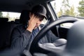 Tired man in car. Sleepy drowsy driver, fatigue. Driving and sleeping in vehicle. Exhausted, bored or drunk person. Royalty Free Stock Photo
