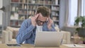 Tired Man having Headache in Loft Office Royalty Free Stock Photo