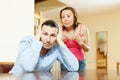 Tired man listening to his angry wife Royalty Free Stock Photo