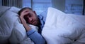 Tired Man Lying Awake In Bed Struggling Royalty Free Stock Photo