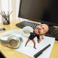 Tired man, office worker holding his huge tired head, funny Royalty Free Stock Photo