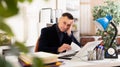 Tired man office worker sitting at table Royalty Free Stock Photo