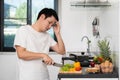 Tired man with preparing vegetables to cooking in kitchen at home Royalty Free Stock Photo