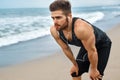 Tired Man Resting After Running On Beach. Sports Workout Outdoor Royalty Free Stock Photo