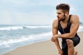 Tired Man Resting After Running On Beach. Sports Workout Outdoor Royalty Free Stock Photo