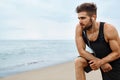 Tired Man Resting After Running On Beach. Sports Workout Outdoor Royalty Free Stock Photo