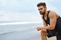 Tired Man Resting After Running On Beach. Sports Workout Outdoor Royalty Free Stock Photo