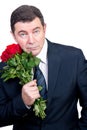 Tired man with roses waiting Royalty Free Stock Photo