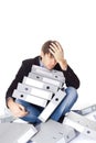 Tired man is sitting with many paper folders isolated on white b Royalty Free Stock Photo