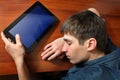 Tired Man sleep with Tablet Royalty Free Stock Photo