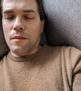 Tired Man Sleeping on Couch - Careworn Face