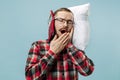 Tired man sleeping at home having too much work. Bored businessman with pillow Royalty Free Stock Photo