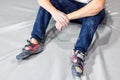 Tired man taking rest after climbing bouldering wall at a wall climbing gym Royalty Free Stock Photo