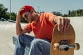 tired man touching beanie while sitting Royalty Free Stock Photo