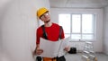 A tired man worker holding apartment plan and thinking about it