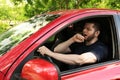 Tired man yawning while driving his car Royalty Free Stock Photo