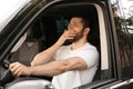 Tired man yawning while driving his car Royalty Free Stock Photo