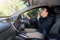 Tired man yawning and sleepy while driving car Royalty Free Stock Photo