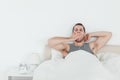 Tired man yawning while waking up Royalty Free Stock Photo