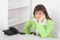 Tired manager reflects at office sitting at table Royalty Free Stock Photo